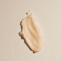 A smear of the Divine Ritual™ Balm on a white sheet of card