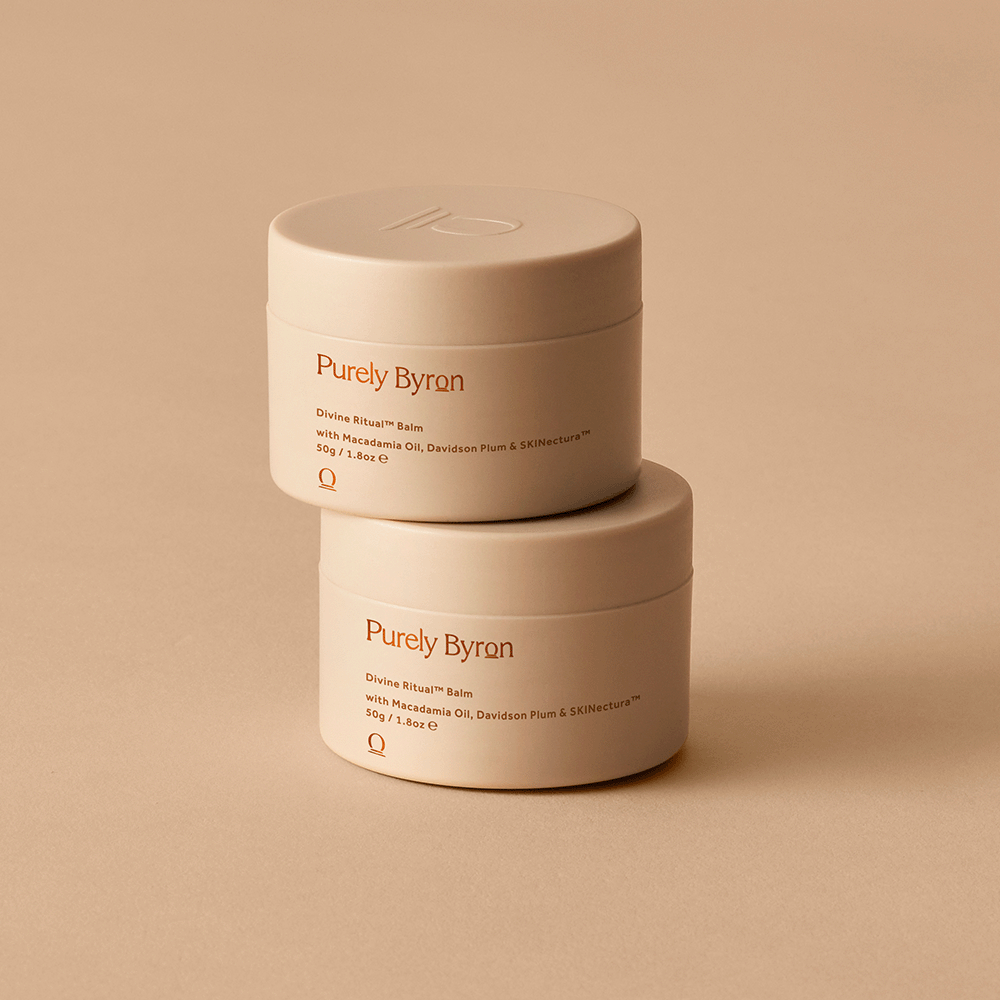 Two Divine Ritual™ Balm pots stacked on top of each other