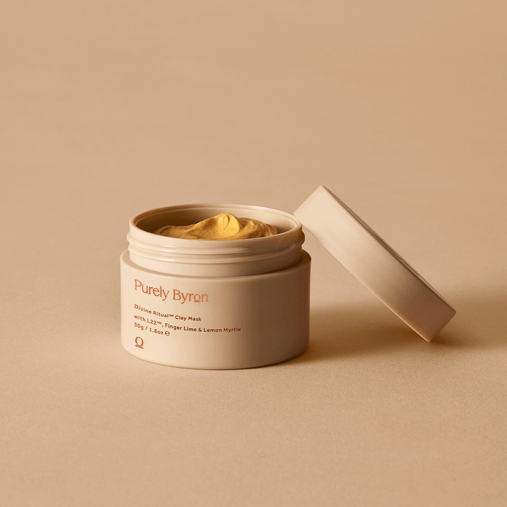 Divine Ritual™ Clay Mask pot opened with the lid leaning up against it