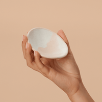 Woman holding a handmade ceramic bowl